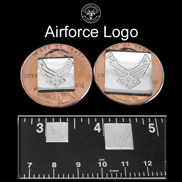 Jet Fighter Jewelry Stud Earrings Size Chart with sterling silver Air Force Logo shown on a ruler and penny in 2 sizes with a dark background