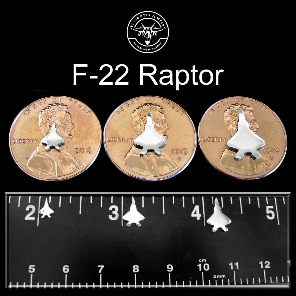 Silver silhouettes of a F-22 Fighter Jet shown on a ruler and pennies in 3 different sizes for stud earrings