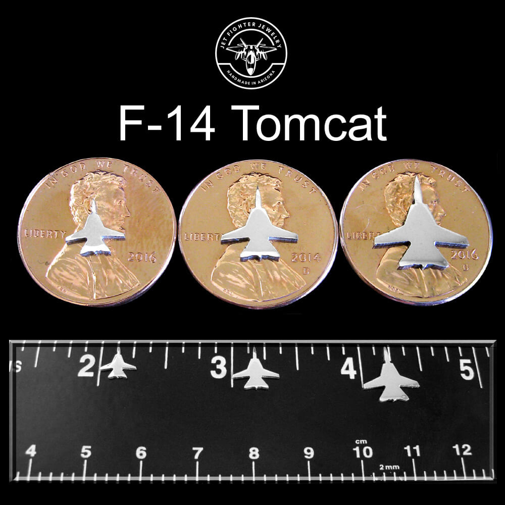 Silver silhouettes of F-14 Tomcat Fighter Jets shown n a ruler and pennies as size reference for stud earrings