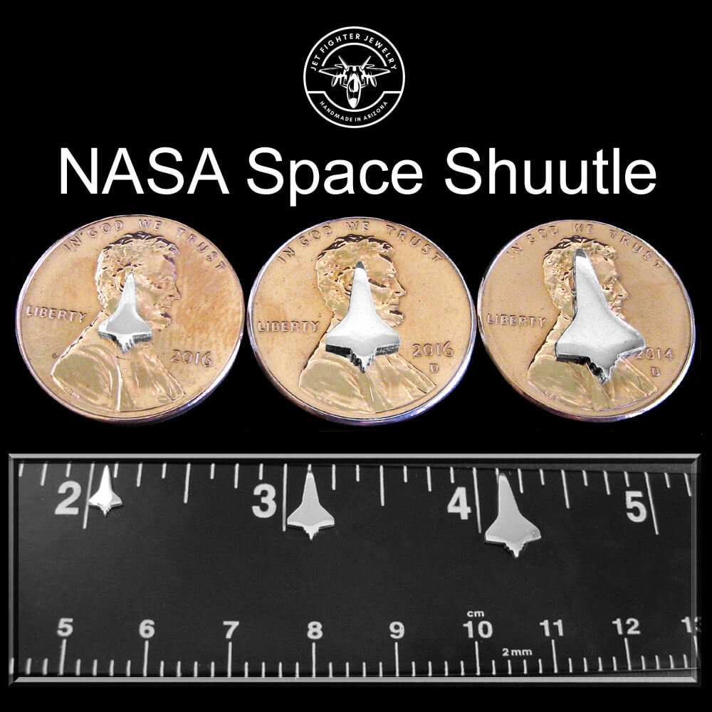 Silver silhouettes of a NASA space shuttle jet shown on a ruler and pennies in 3 unique sizes for stud earrings