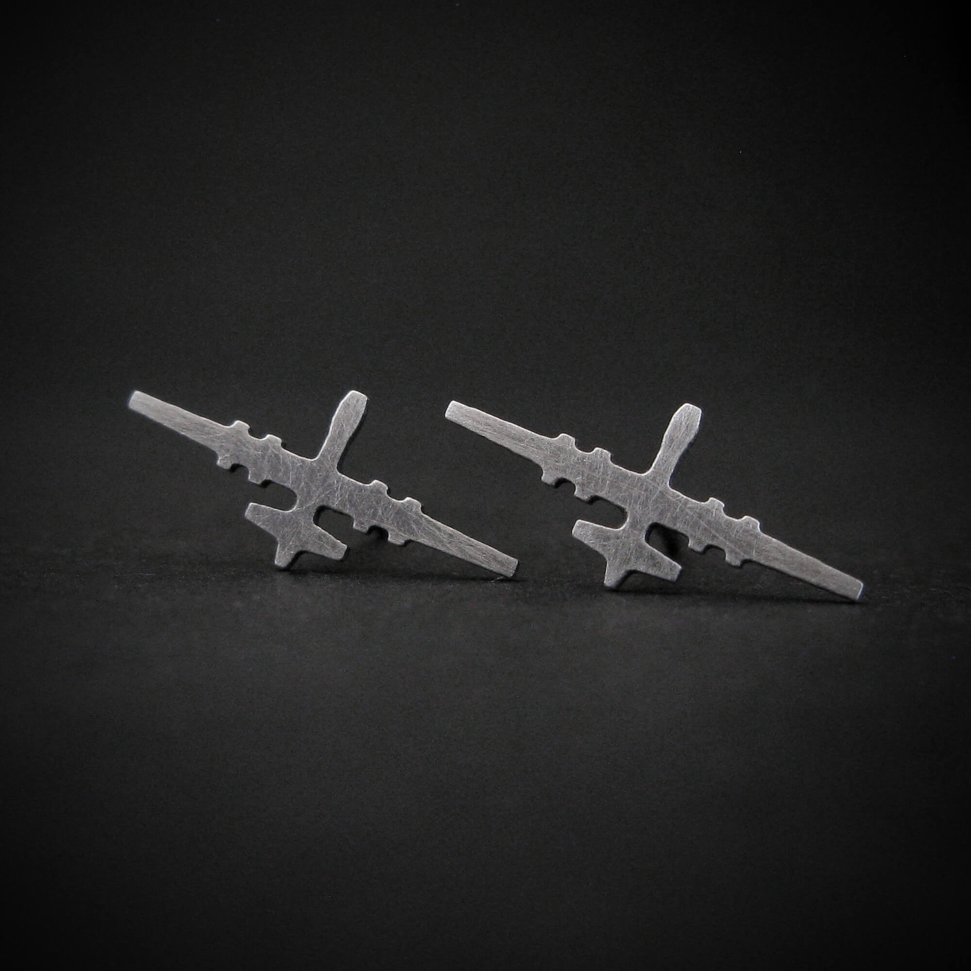 MQ-9 Reaper Military Drone Aircraft Stud Earrings in Antiqued Sterling Silver on a dark background