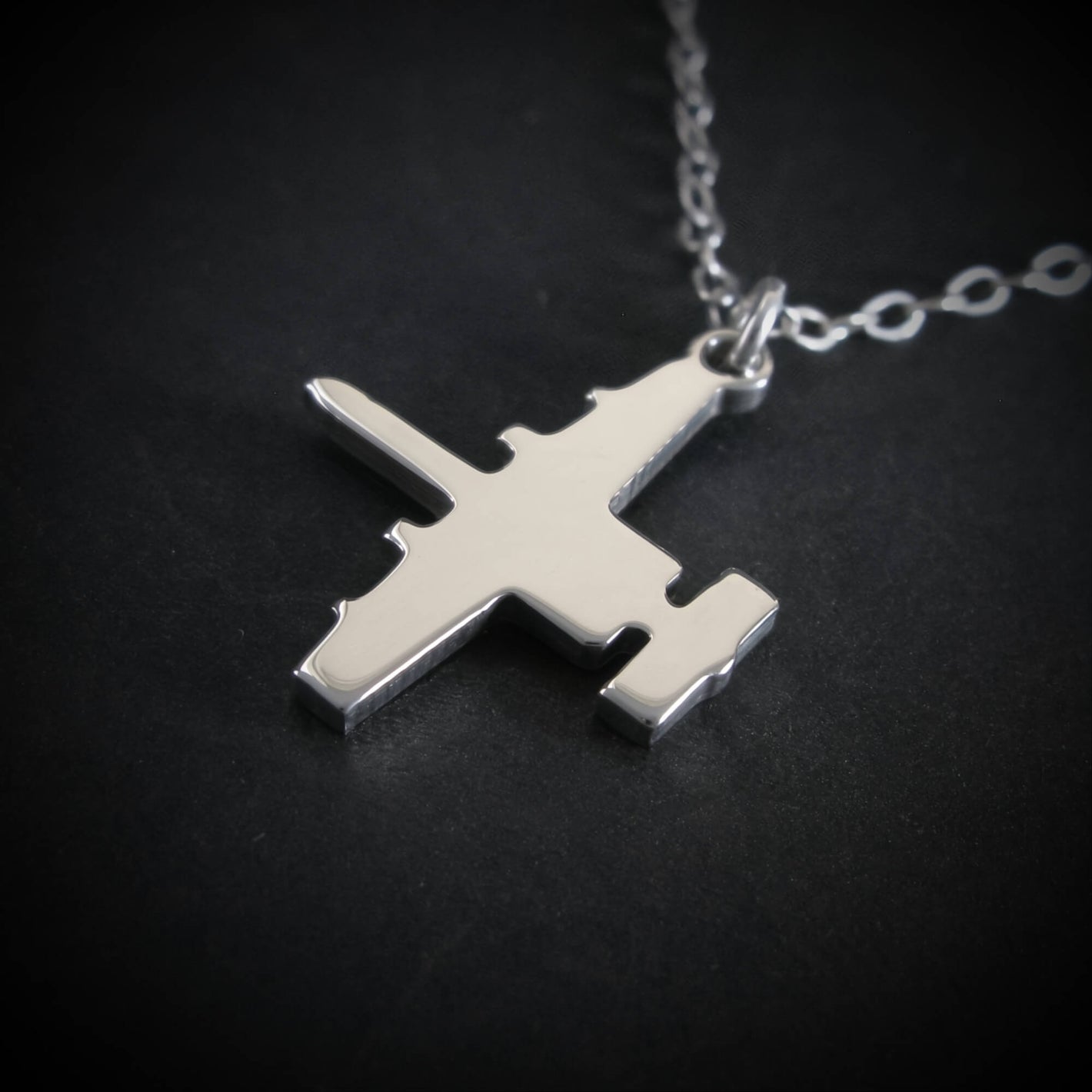 Close-up sterling silver A-10 Warthog aircraft pendant necklace aviation jewelry
