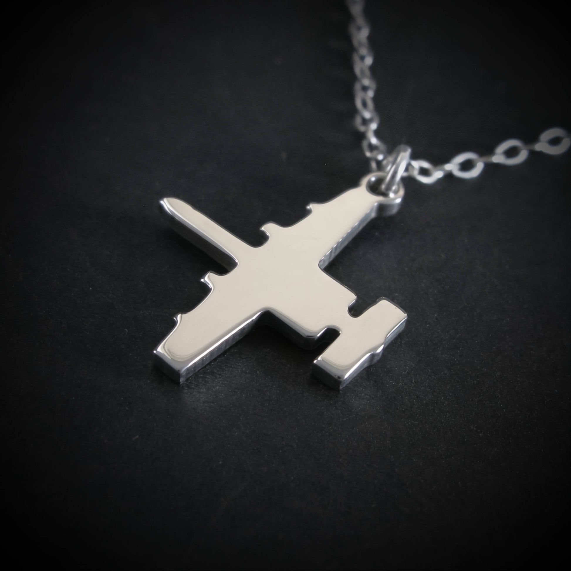 Close-up sterling silver A-10 Warthog aircraft pendant necklace aviation jewelry
