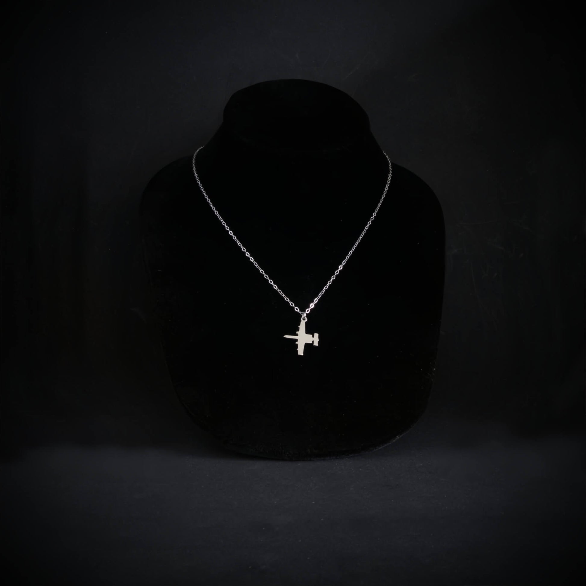 A-10 Thuderbolt military jet pendant necklace handmade in sterling silver on display bust