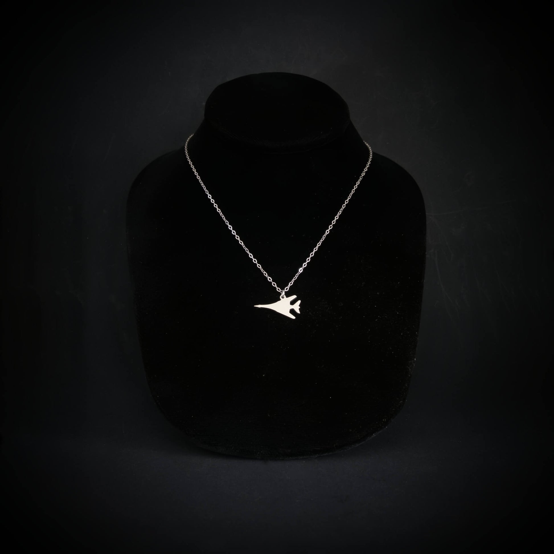 B-1 Lancer bomber jet pendant necklace handmade in sterling silver on display bust, military aviation jewelry