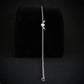 Sterling silver B-21 Raider dainty bracelet displayed on velvet stand