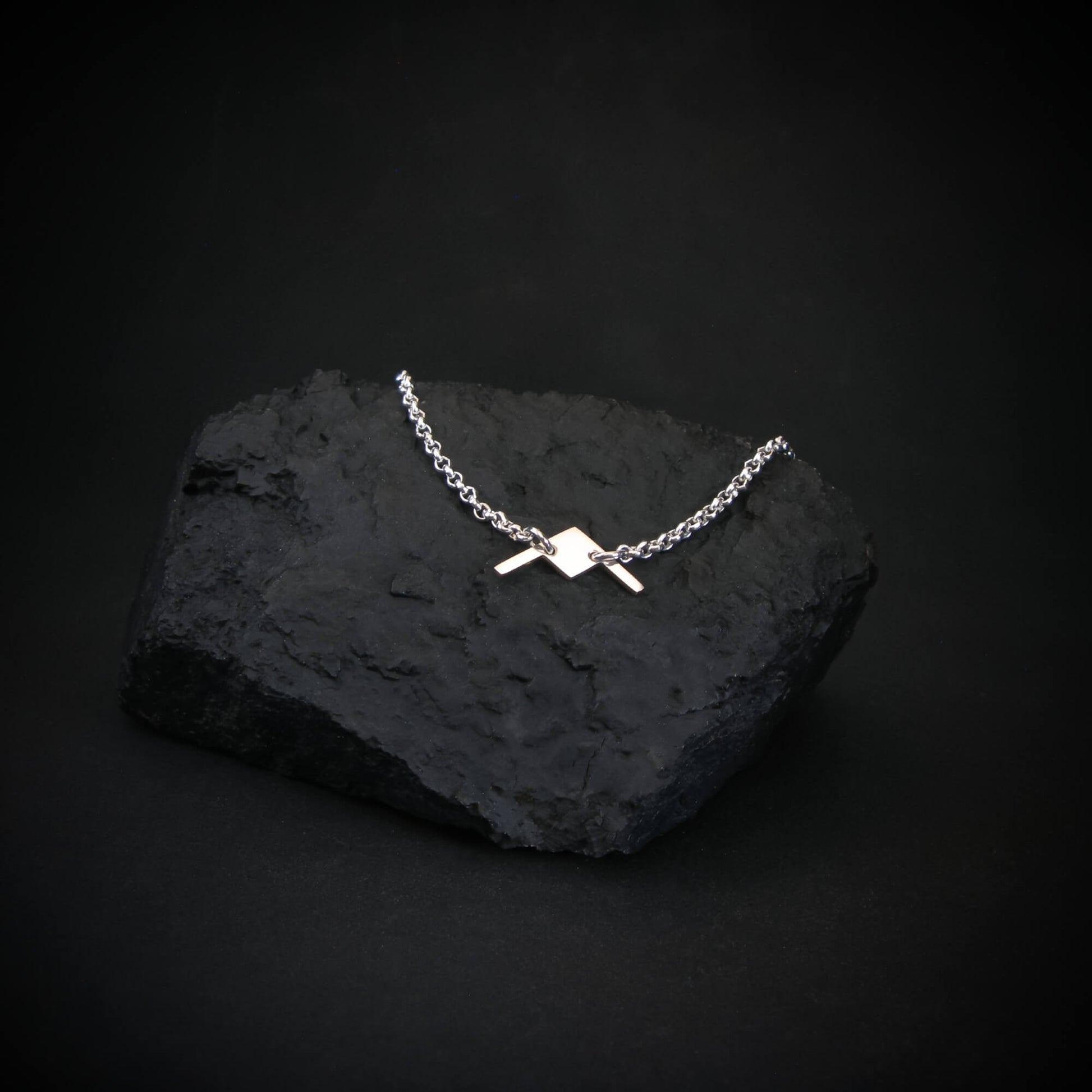 B-21 Raider sterling silver bracelet on black stone display