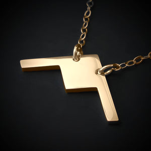 Polished 14k gold B-21 Raider stealth bomber airplane pendant on chain