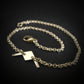 B-21 Raider bomber dainty chain bracelet in 14k gold on black background