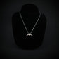 Sterling silver B-21 Raider stealth bomber pendant necklace on display bust by Jet Fighter Jewelry