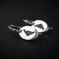 Sterling silver B‑2 Spirit bomber airplane oval dangle earrings on black background – handmade aviation jewelry