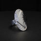 Hammered silver oval ring with a raised B-2 Bomber Military Aviation Jet silhouette on a black background