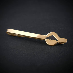 14k gold B-2 Spirit Bomber tie bar featuring engraved stealth jet silhouette on dark background