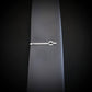 Sterling silver B-2 Spirit Bomber tie clip attached to gray necktie, showcasing sleek engraved design