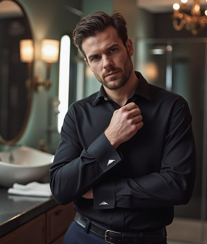 Man standing in bathroom with a black shirt and silver B-2 Bomber Jet Cuff Links in nice lighting
