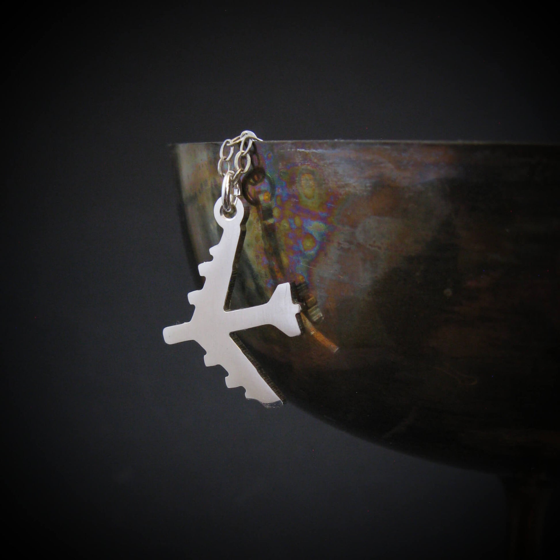 Silver B-52 Bomber Stratofortress Military Jet pendant on a dark background