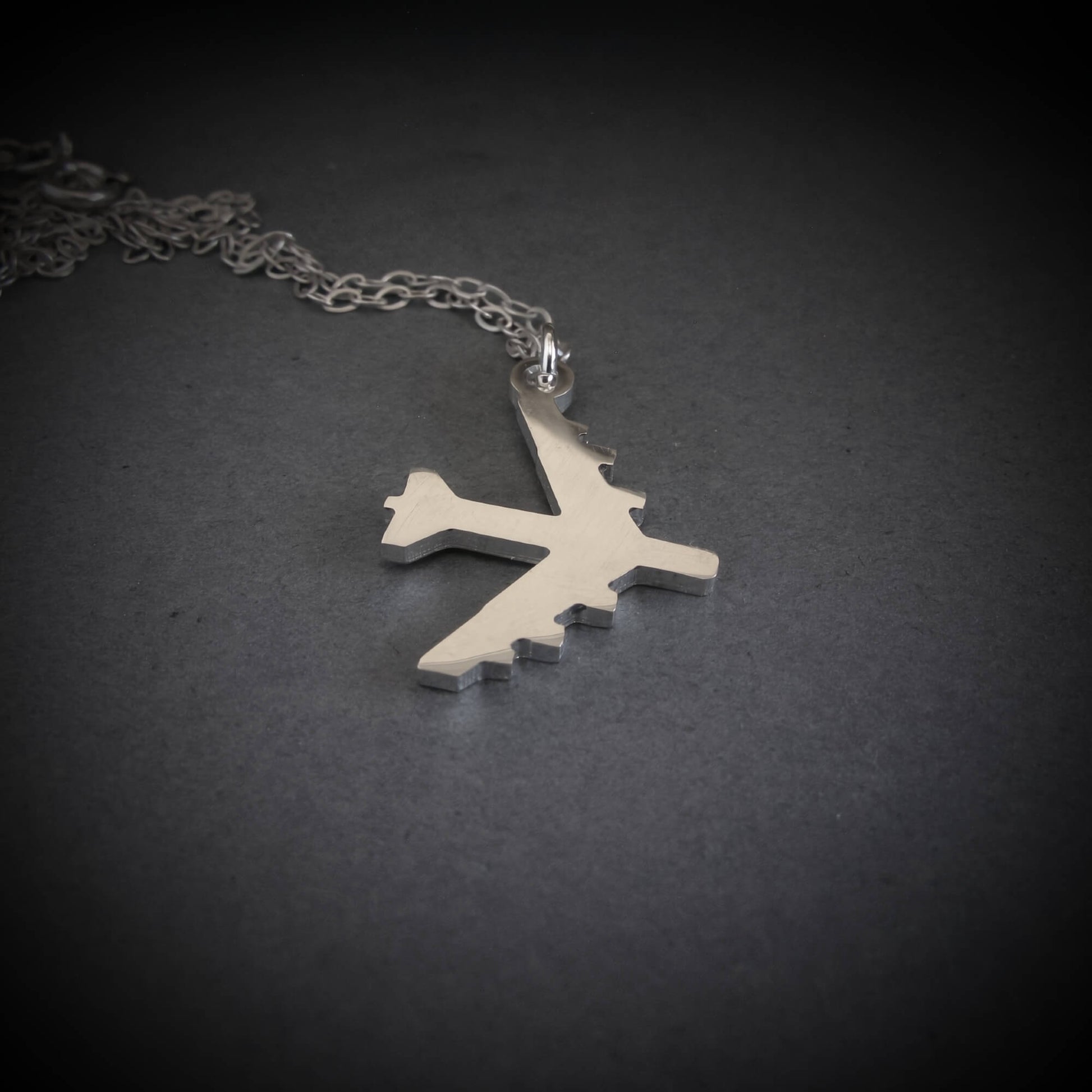 Silver B-52 Bomber Stratofortress Military Jet pendant on a dark background