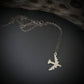 Silver B-52 Bomber Stratofortress Military Jet pendant on a dark background