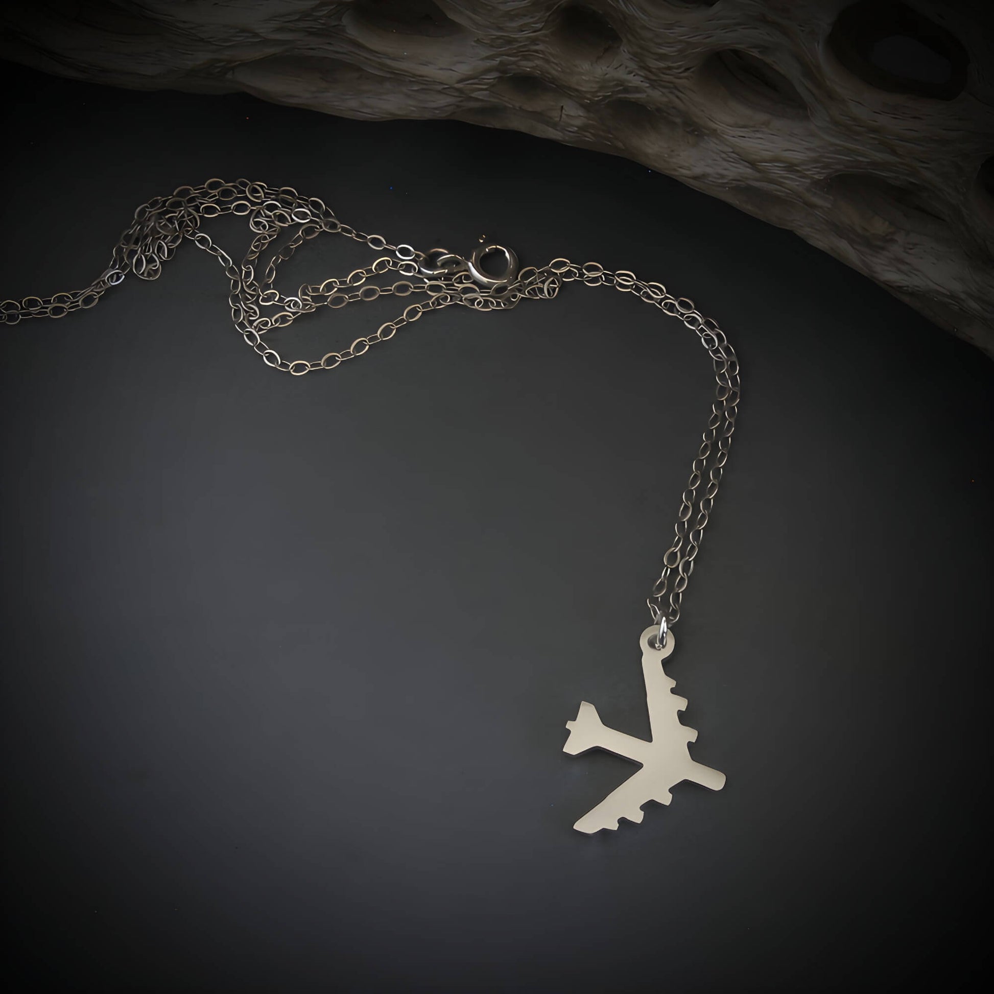 Silver B-52 Bomber Stratofortress Military Jet pendant on a dark background