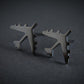 Oxidized Silver B-52 military Fighter Jet airplane shaped earrings with a dark background
