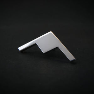 Silver B-21 Raider Bomber Jet Silhouette Tie Pin on a dark background