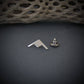Silver B-21 Raider Bomber Jet Silhouette Tie Tack and locking back on a dark background