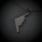 Oxidized Silver B-2 Spirit Bomber Military Jet Pendant necklace on a dark background