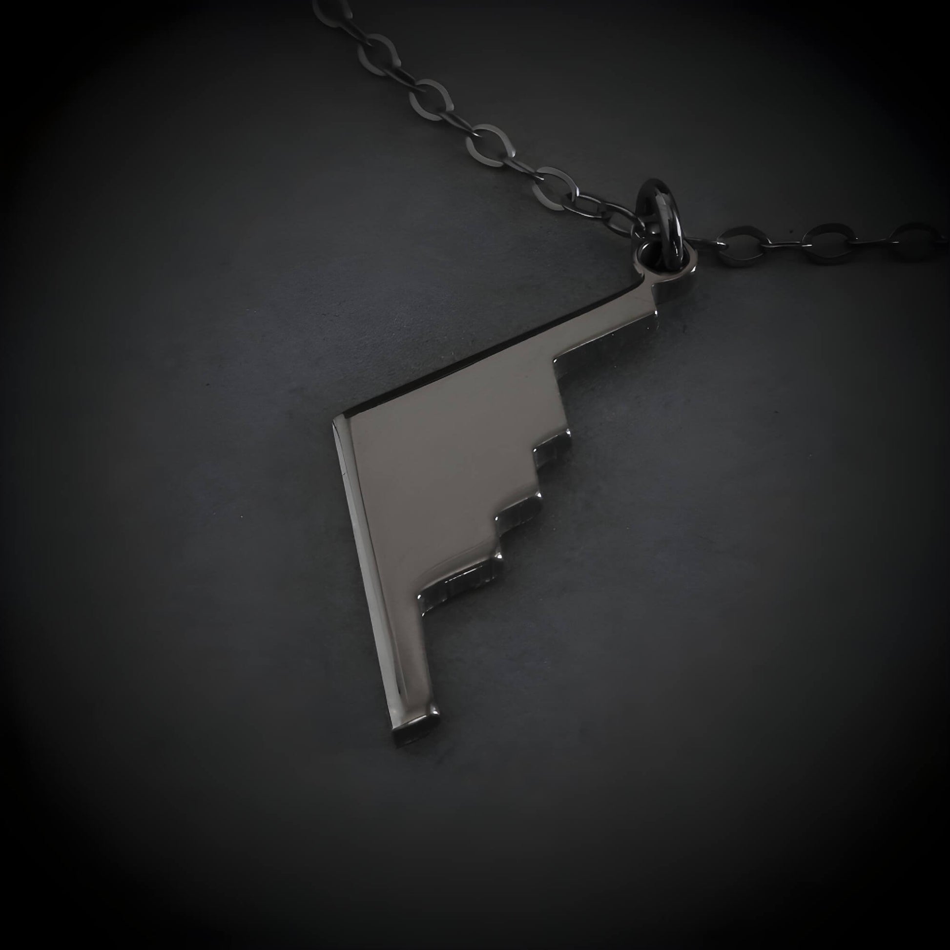 Oxidized Silver B-2 Spirit Bomber Military Jet Pendant necklace on a dark background