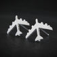 Brushed Silver B-52 military Fighter Jet airplane shaped earrings with a dark background
