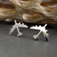 Sterling Silver B-52 military Fighter Jet airplane shaped earrings with a natural dark background