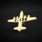 Gold C-130 airplane shaped lapel pin with 'C-130' text on a black background