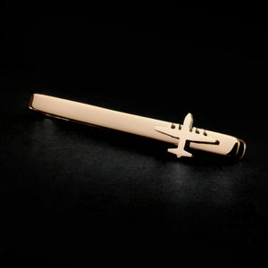 14k gold C130 Hercules military aviation tie clip on a black background