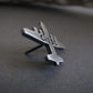 Side View of an Antiqued sterling silver C-130 Hercules airplane tie tack with engraved text on gray background – handcrafted aviation jewelry