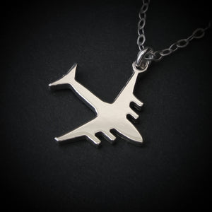C-17 Globemaster military airplane pendant necklace in polished sterling silver, shown close-up against a dark background.