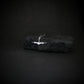 Sterling silver C-130 Hercules necklace styled on black rock