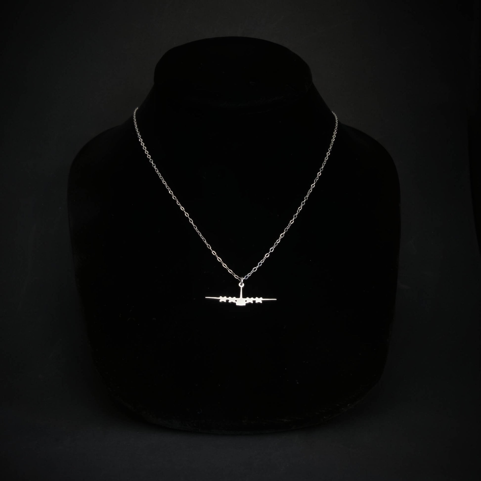 C-130 military aviation silhouette necklace on black bust display