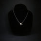 Sterling silver C-17 jet pendant necklace displayed on black bust