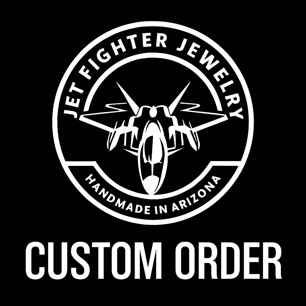 Logo of Jet Fighter Jewelry with a fighter jet and text 'Handmade in Arizona' on a black background.
