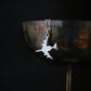 Sterling silver E-3 Sentry AWACS aircraft pendant necklace draped on wine goblet military aviation jewelry