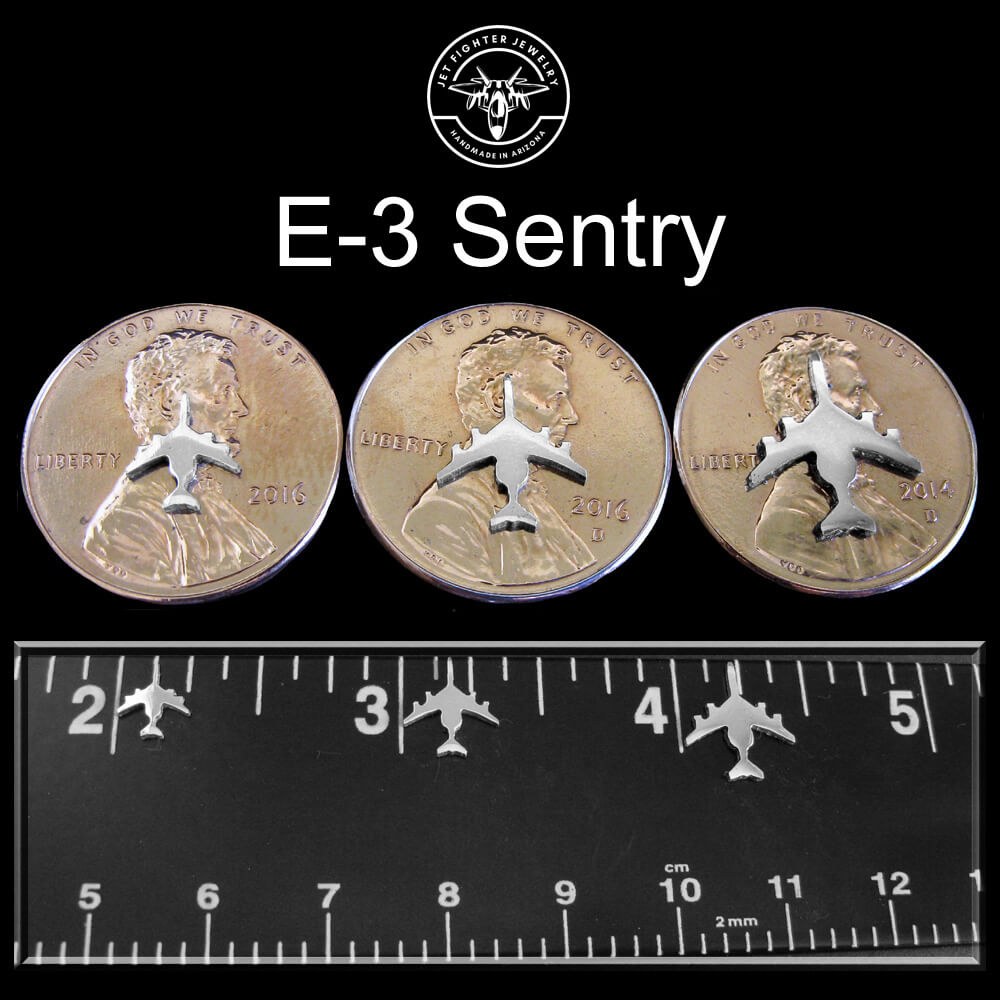 Silver E-3 Sentry Silhouettes shown on a ruler and pennies in 3 different sizes with a Jet Fighter jewelry logo