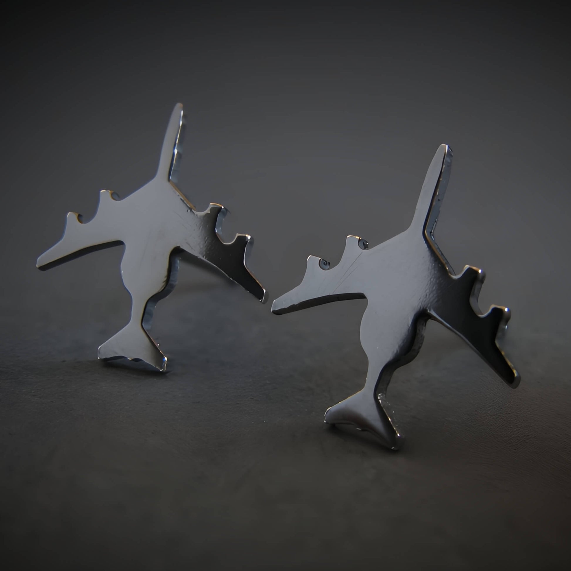 Oxidized Sterling Silver E-3 Sentry military jet airplane shaped stud earrings on a black background