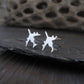 Polished Sterling Silver E-3 Sentry military jet airplane shaped stud earrings on a stone background