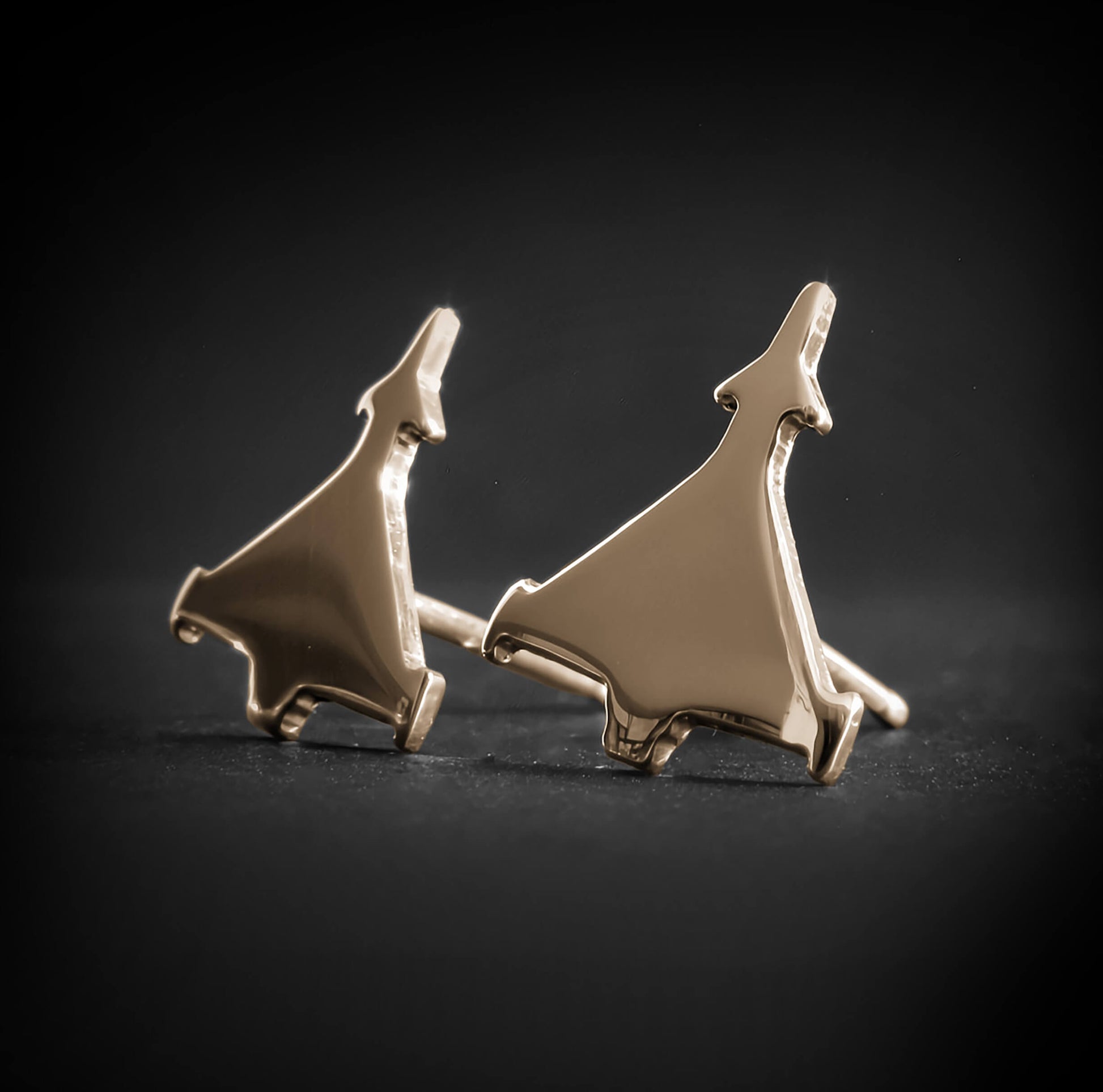 14k Gold Eurofighter Typhoon fighter jet stud earrings on dark background