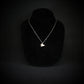 F-117 Nighthawk stealth fighter jet pendant necklace in sterling silver, handmade military aviation jewelry on black display bust