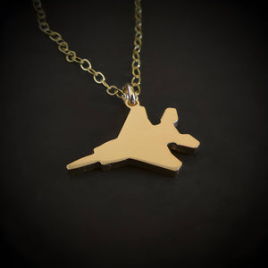 14k gold-filled F-15 Eagle jet pendant necklace on chain, close-up on black background
