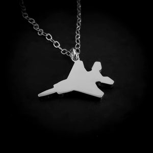 Sterling silver F-15 Eagle jet fighter pendant necklace close-up on black background