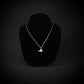 Sterling silver F-15 Eagle military jet pendant necklace displayed on black bust