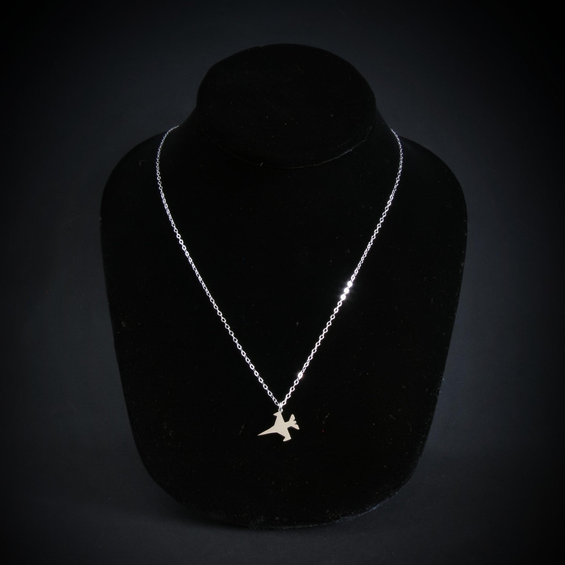 Sterling silver F-16 Fighting Falcon jet necklace on display – handcrafted aviation jewelry gift for Air Force service members