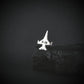 Silver Military Jet Fighter airplane Viper tie tack with F-16 engraving on a dark background