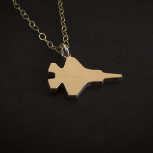 14k Gold F-35 Military Fighter Jet pendant on a chain against a black background